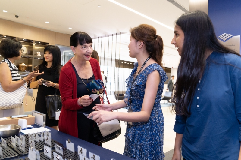 event attendees smile during registration