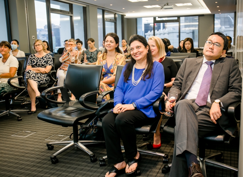 Skadden staff members are seated in rows whilst listening to the presentation