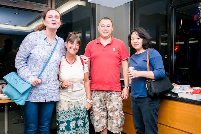 1 man and 3 women in casual attire who were participants of the training seminar are standing together for a photo