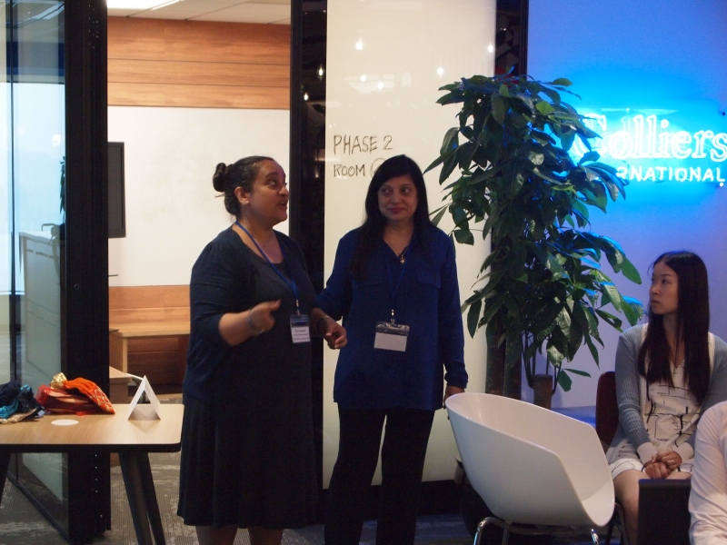2 SENsational staff members in business attire are giving the training whilst standing