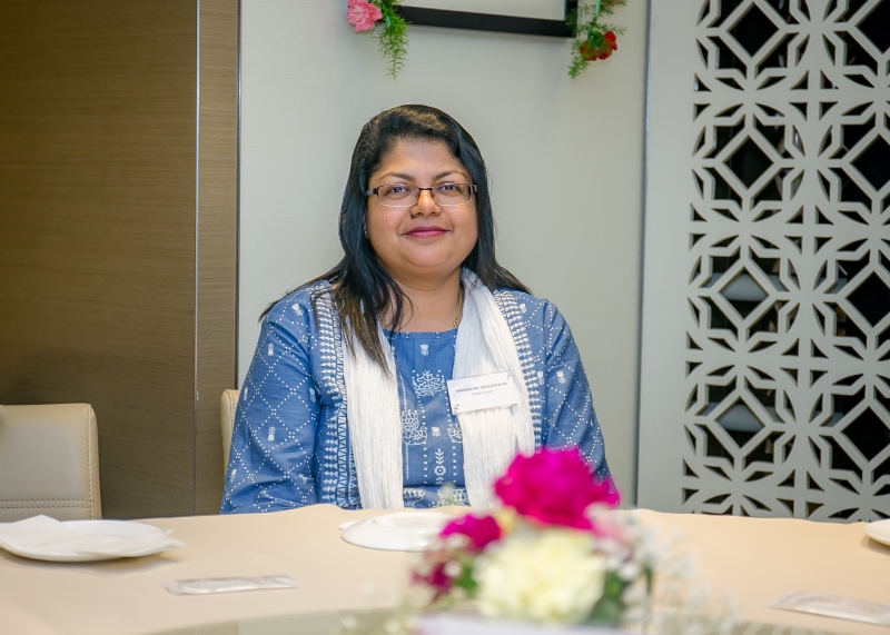 A event attendee sitting at a table
