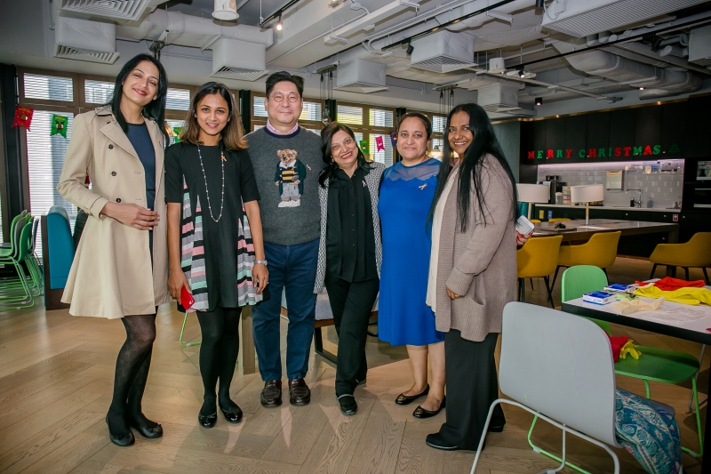 1 man smart casual attire and 5 women in business attire